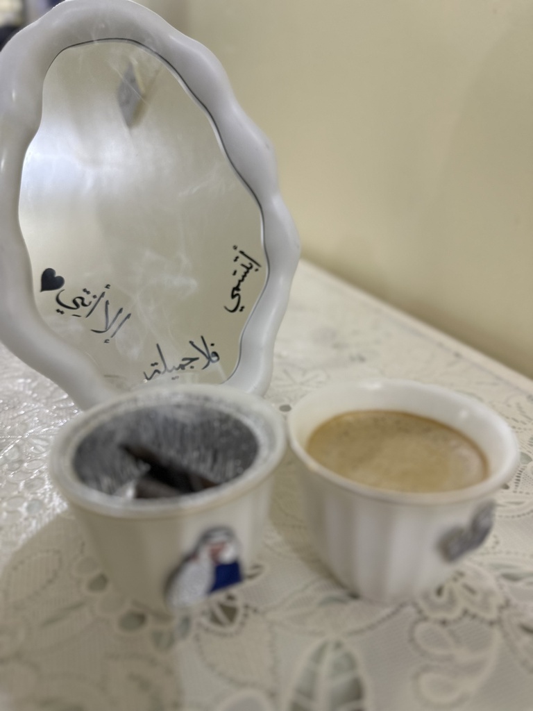 A mirror with the phrase "Smile, there is no one beautiful but you"